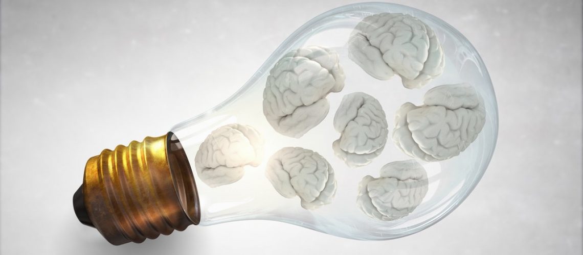 Idea concept with brain inside of light bulb